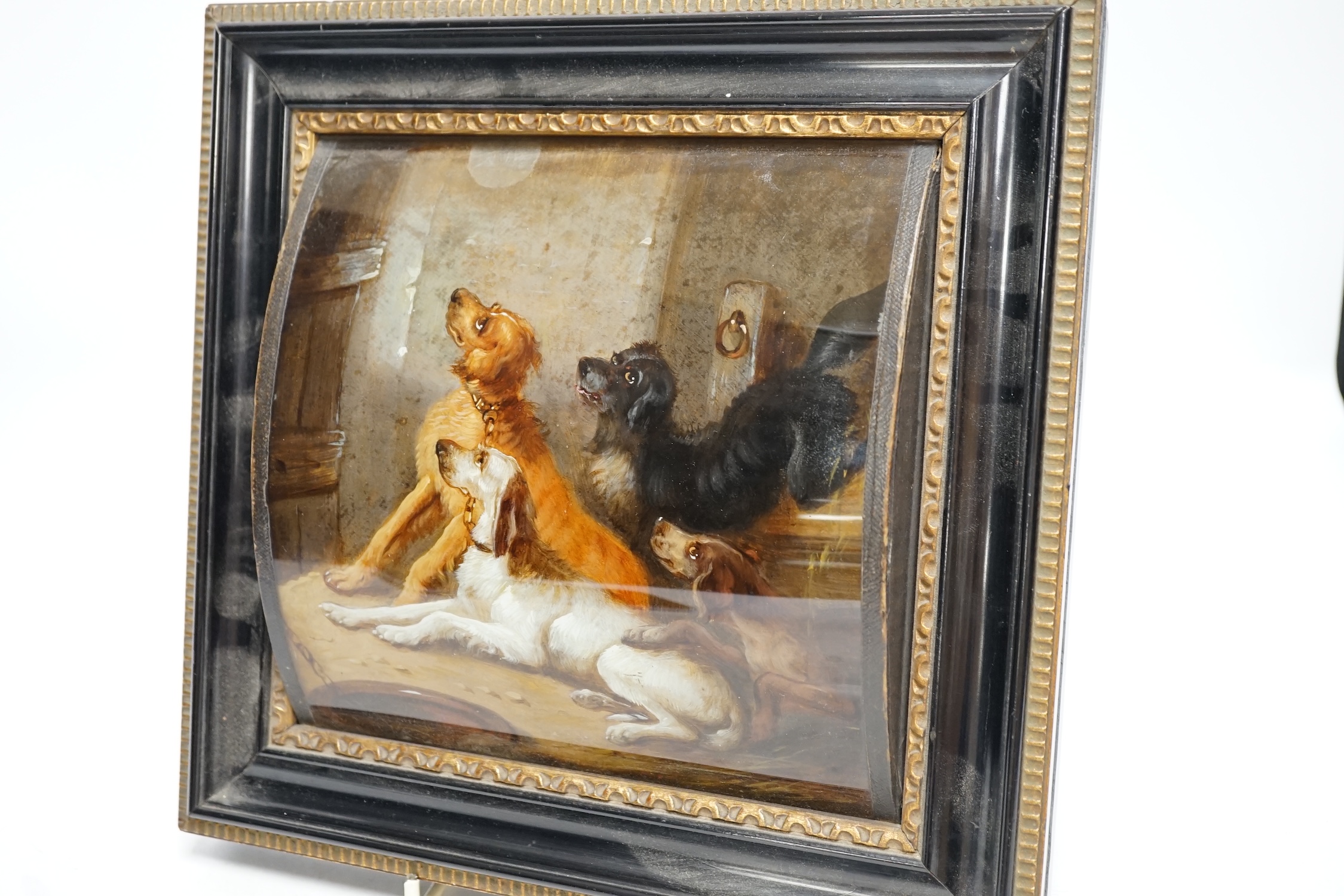 A framed reverse painted glass picture of four hounds, late 19th / early 20th century, 19cm wide, 18.5cm high. Condition - good